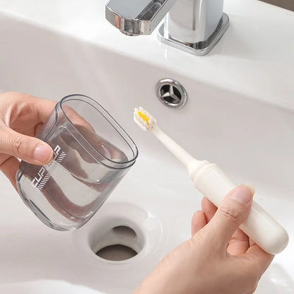 Toothbrush travel container travel grooming set - including toothbrush, mouthwash cup, and dispensing bottle - essential for tra